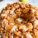 Simple Apple Fritter Monkey Bread with slices of apples in the background