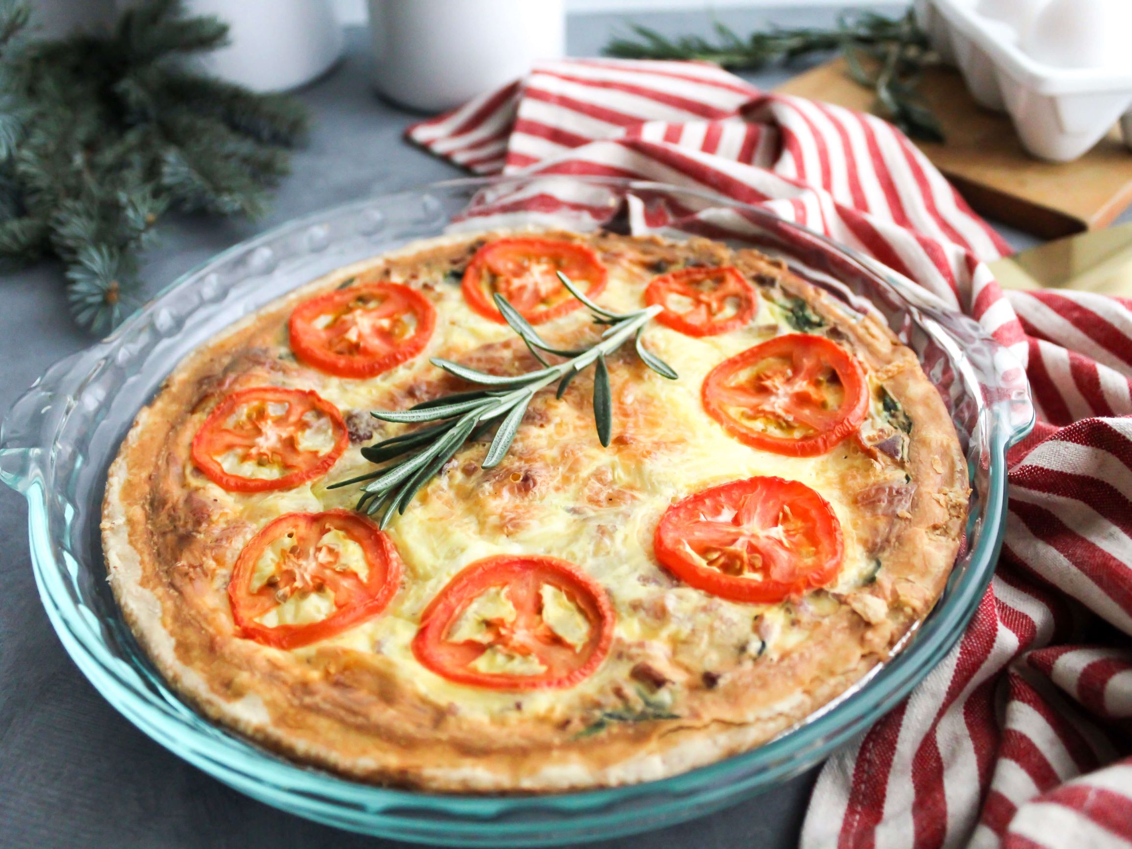 Easy Christmas Quiche with roma tomatoes on top