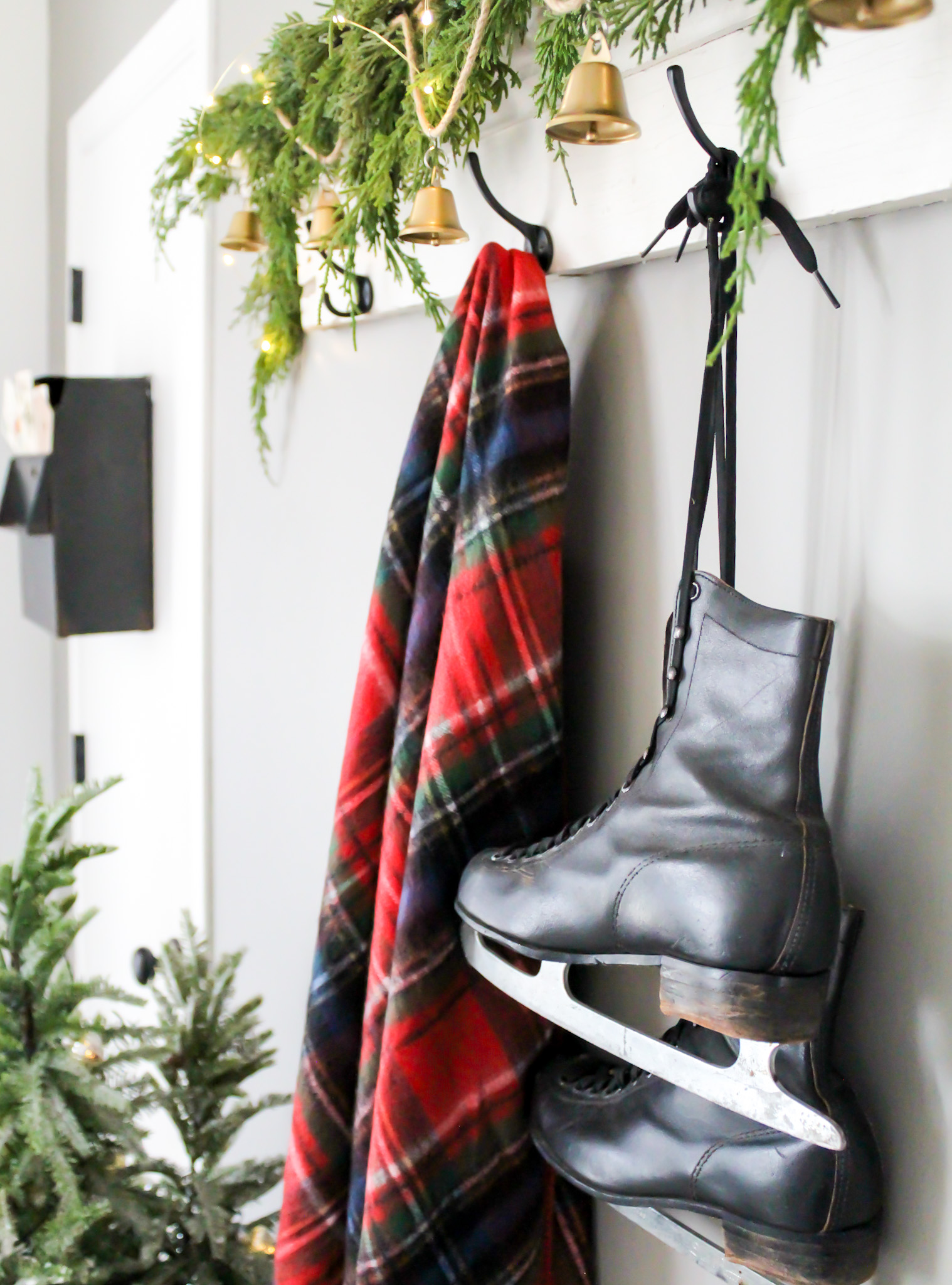 Christmas Entry with Plaid Blanket and Vintage Ice Skates - 5 Simple Ways To Get Ready For Christmas Now - Midwest Life and Style Blog