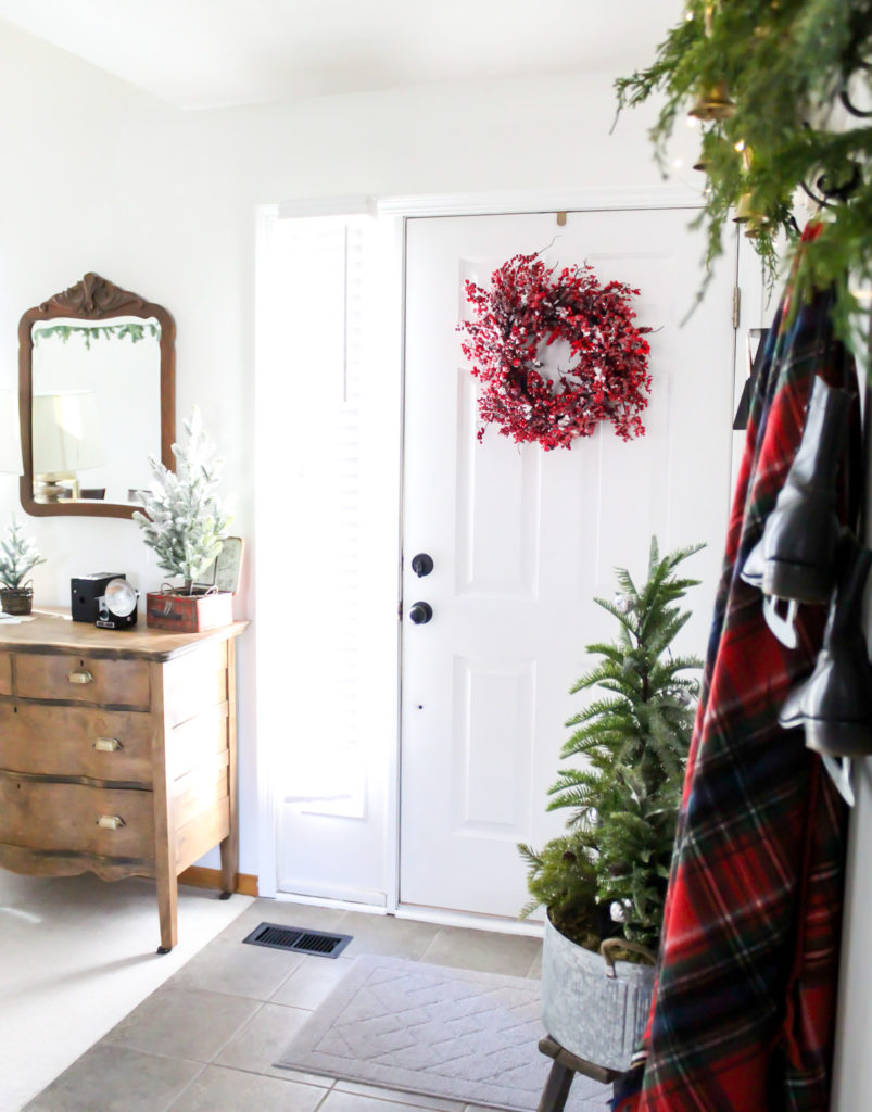 Plaid blanket and red berry wreath - Midwest Life and Style Blog