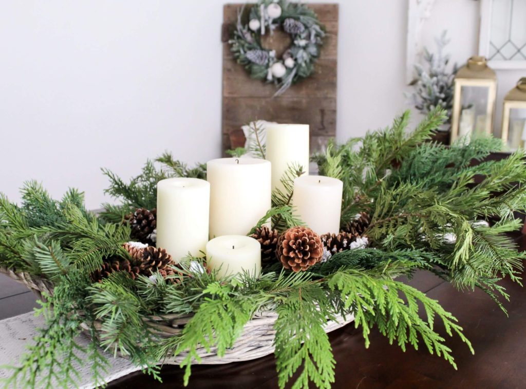 Simple and Festive Christmas Centerpiece Ideas - Christmas Greenery in Basket with Pinecones and Candles