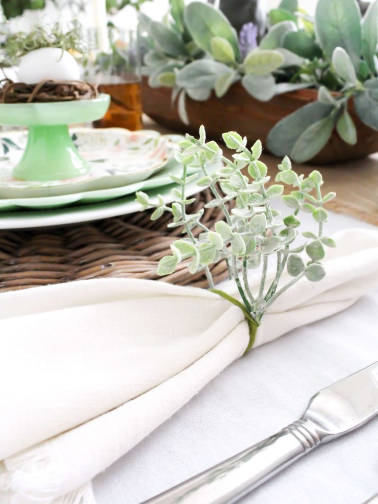 DIY napkin rings for spring or Easter made with faux greenery