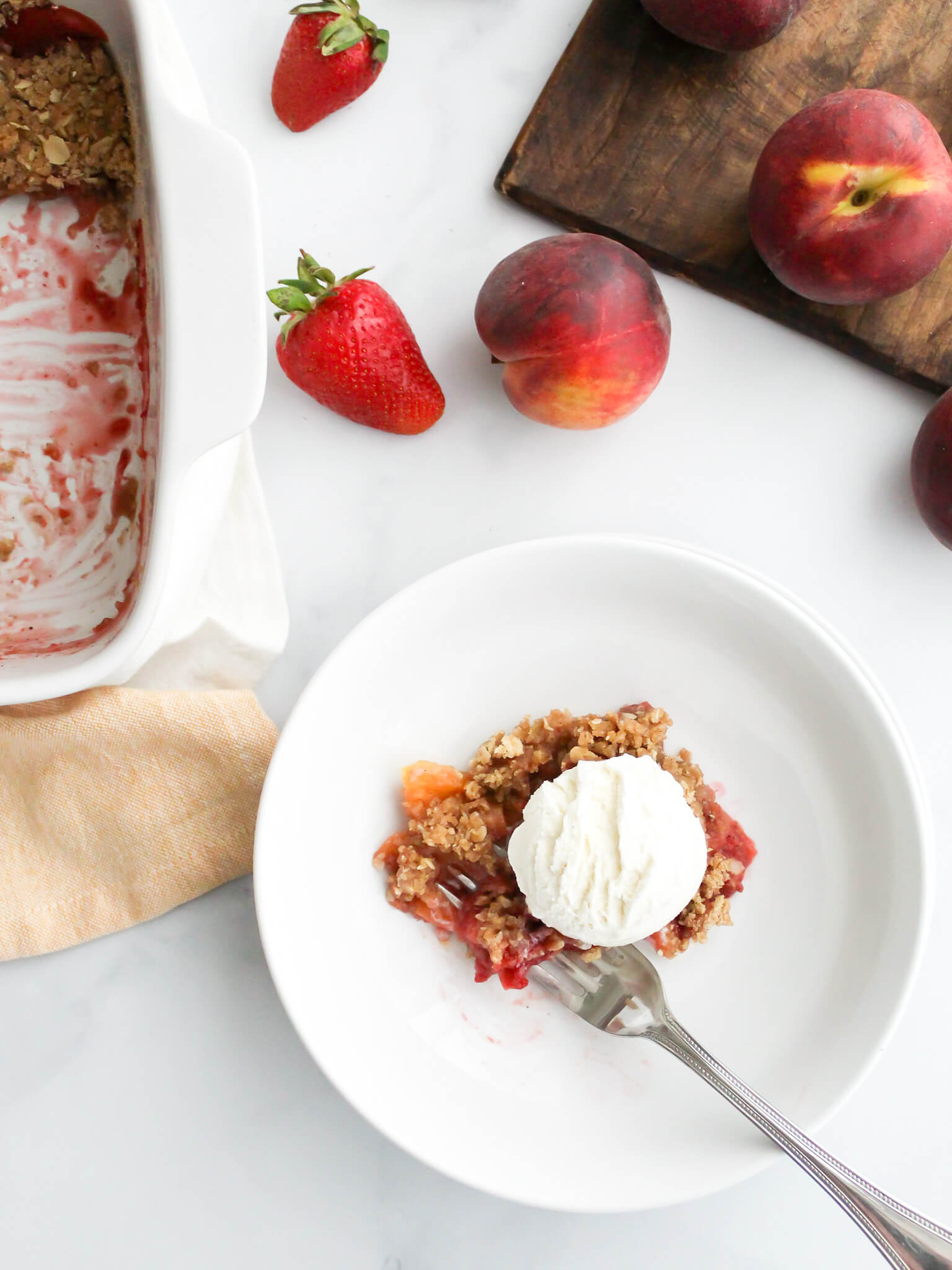 Bowl of Strawberry Peach Crisp with Ice Cream