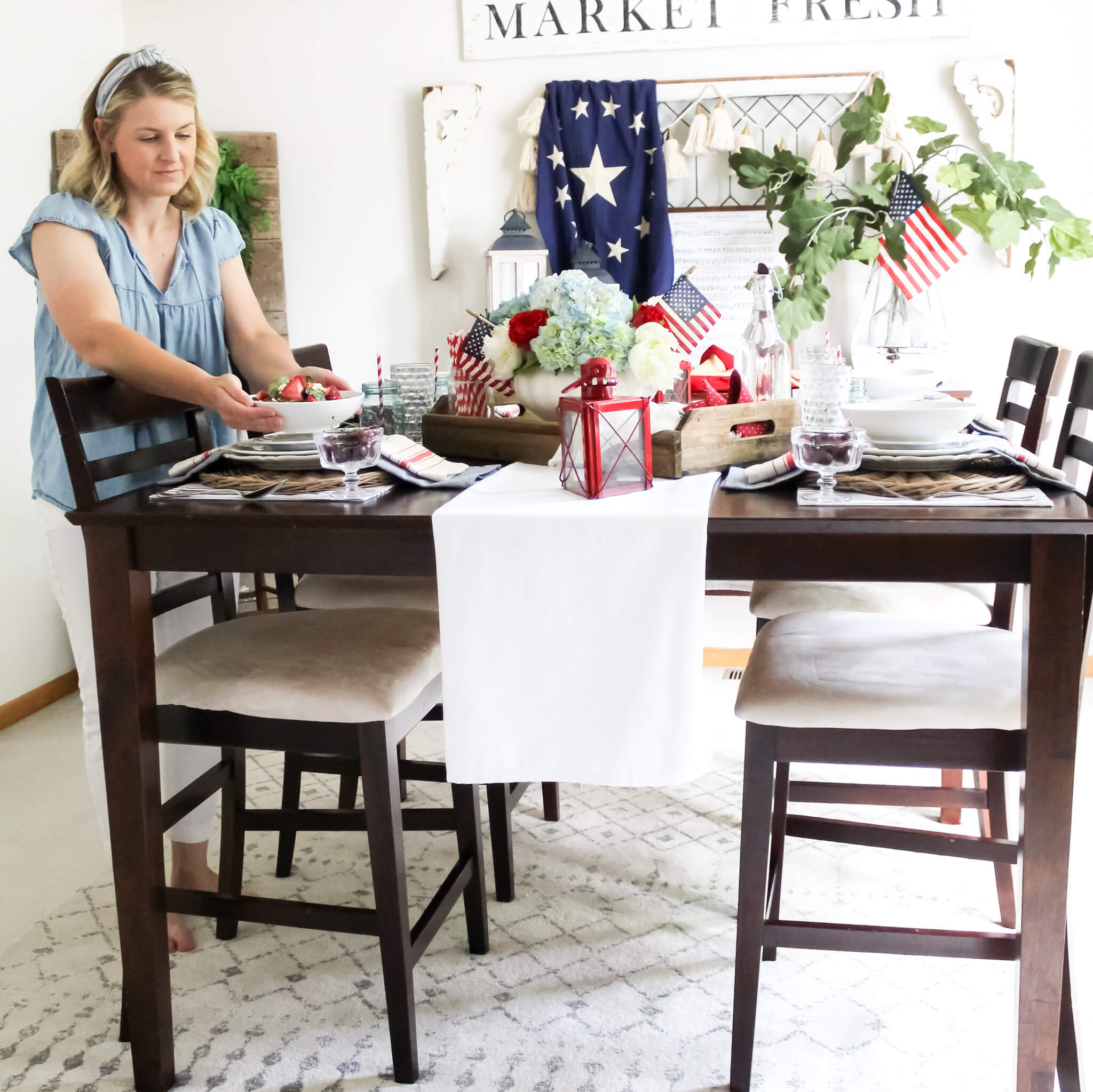 Setting the dining room table with rustic farmhouse patriotic decor for the 4th of July