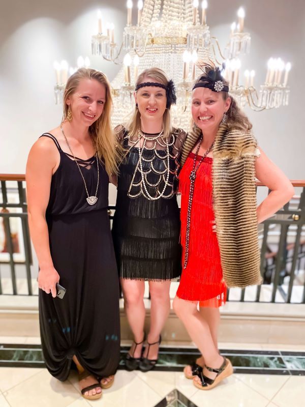 Dressed up in flapper costumes for the Roaring 20's themed farewell party. 