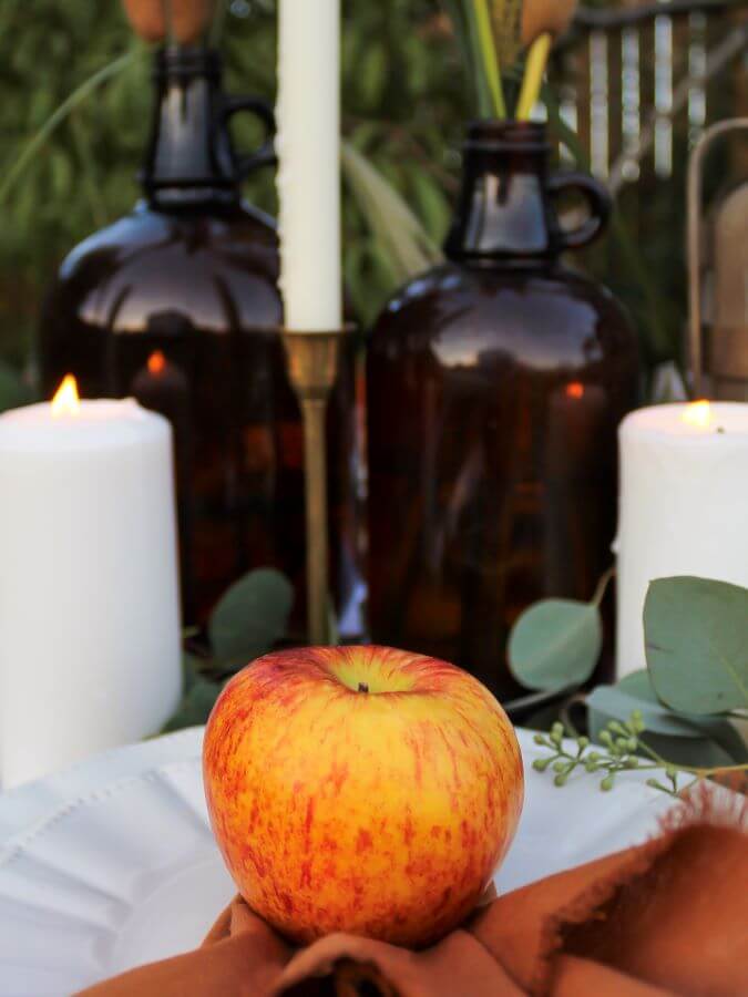 Fall Tablesetting wiith Amber Bottles and Apples - Midwest Life and Style Blog