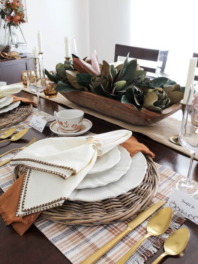 Thanksgiving Table Setting with Rattan Charger, Plaid Placemats, White Dishes, Vintage China, and Gold Silverware - Midwest Life and Style Blog