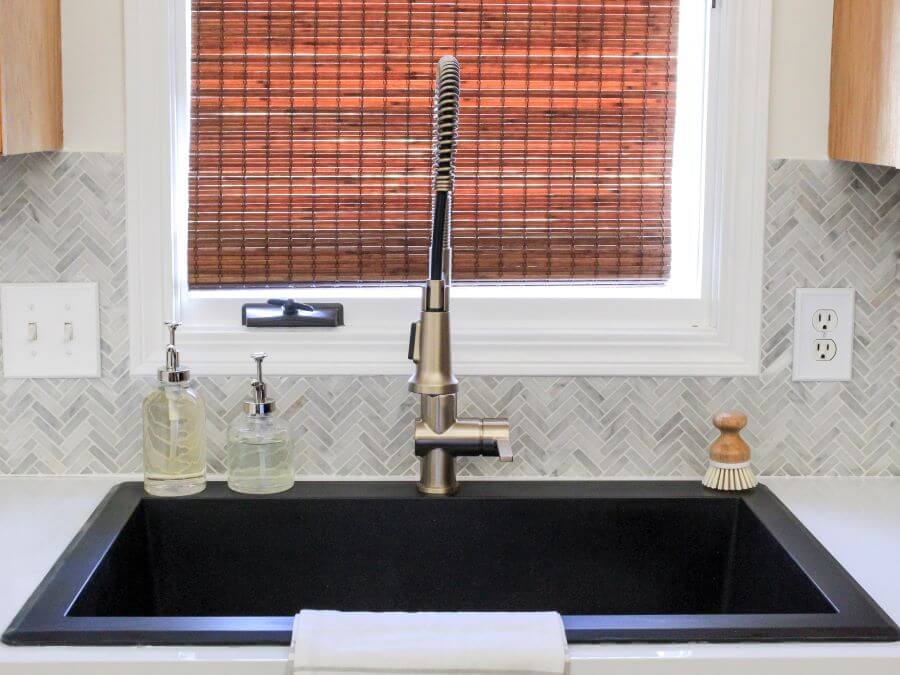 Granite single bowl black kitchen sink with brushed brass high arch faucet - Midwest Life and Style Blog