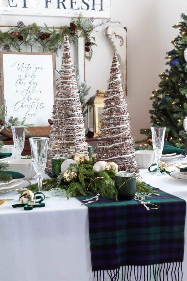 Simple and Festive Christmas Centerpiece Ideas - Rustic Christmas Cone Trees with Garland, Ornaments, and a Green and Blue Color Scheme with Tartan Plaid Accents