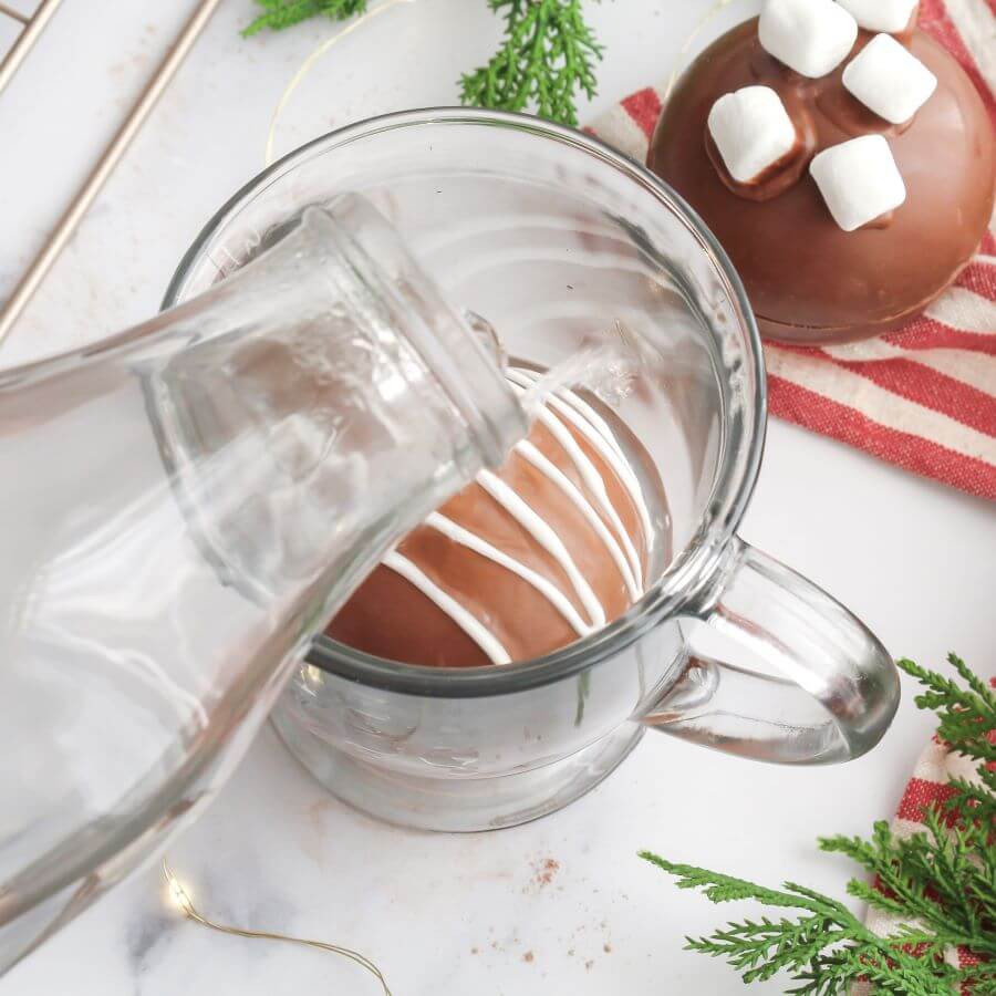 Pouring Hot Water Over Homemade Cocoa Bomb - Midwest Life and Style Blog