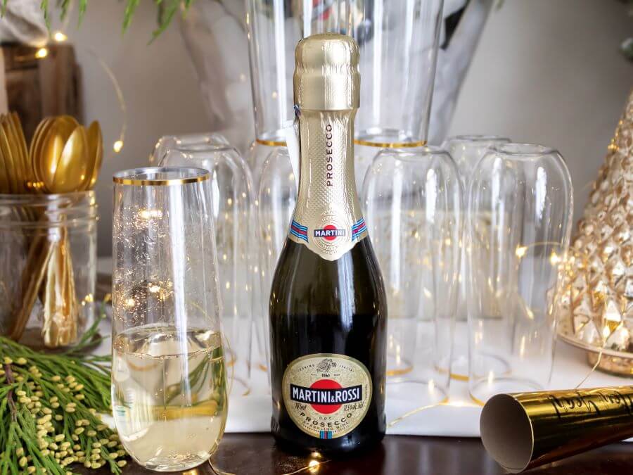 Mini Prosecco Bottles on Ice with Greenery for Festive NYE Party - Midwest Life and Style Blog