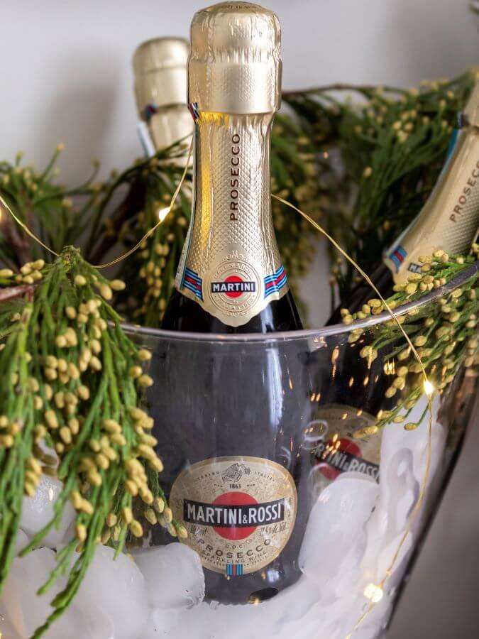 Mini Prosecco Bottles on Ice with Greenery for Festive NYE Party - Midwest Life and Style Blog