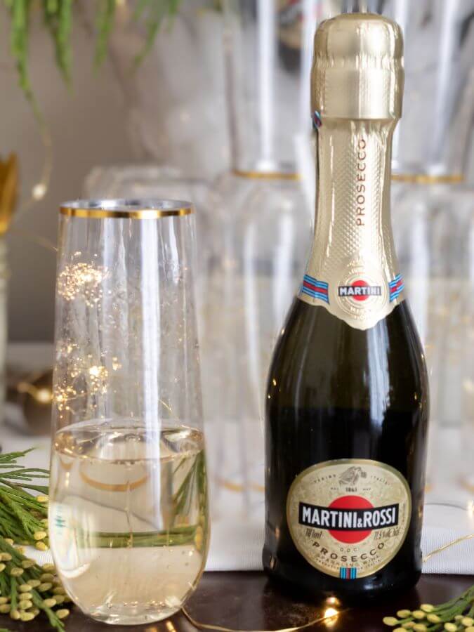 Mini Prosecco Bottles on Ice with Greenery for Festive NYE Party - Midwest Life and Style Blog