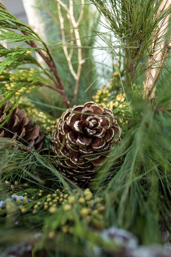 Winter Porch Pot with Pinecones and Gold Branches - Midwest Life and Style Blog