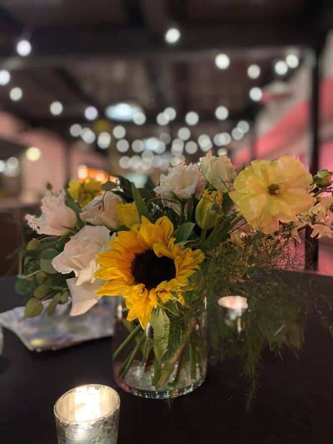 spring bouquet with cream roses and sunflwoers