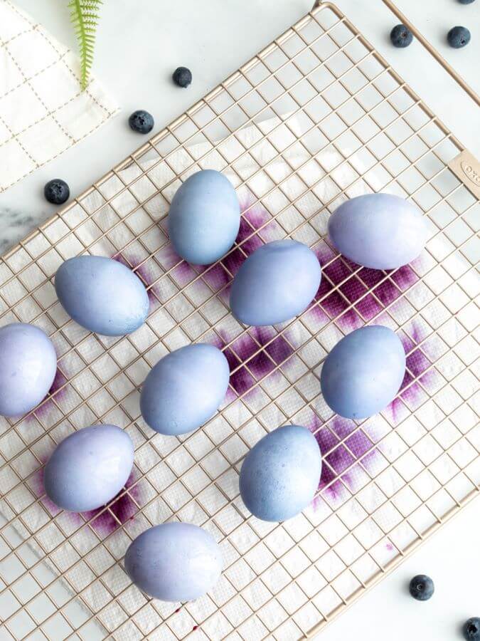 Easter eggs dyed with blueberries drying on a gold cooling rack - Week in Rewind Volume 75 - Midwest Life and Style Blog