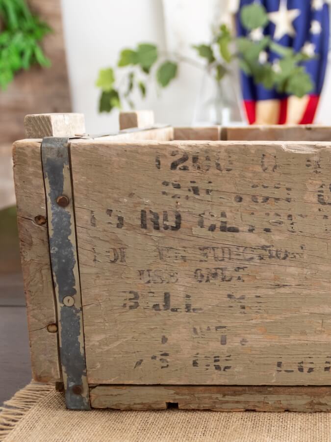 Close up View of Weathered Printing Detail on Vintage Wood Crate for Patriotic Centerpiece 