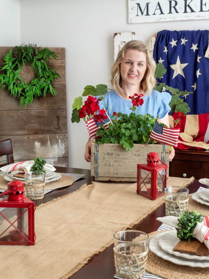 Jen Svendsen Blogger at Midwest Life and Style standing in her dining room decorated for the 4th of July