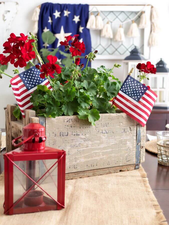 Simple 4th of July Centerpiece with Red Geraniums and American Flags in Vintage Crate - Midwest Life and Style Blog