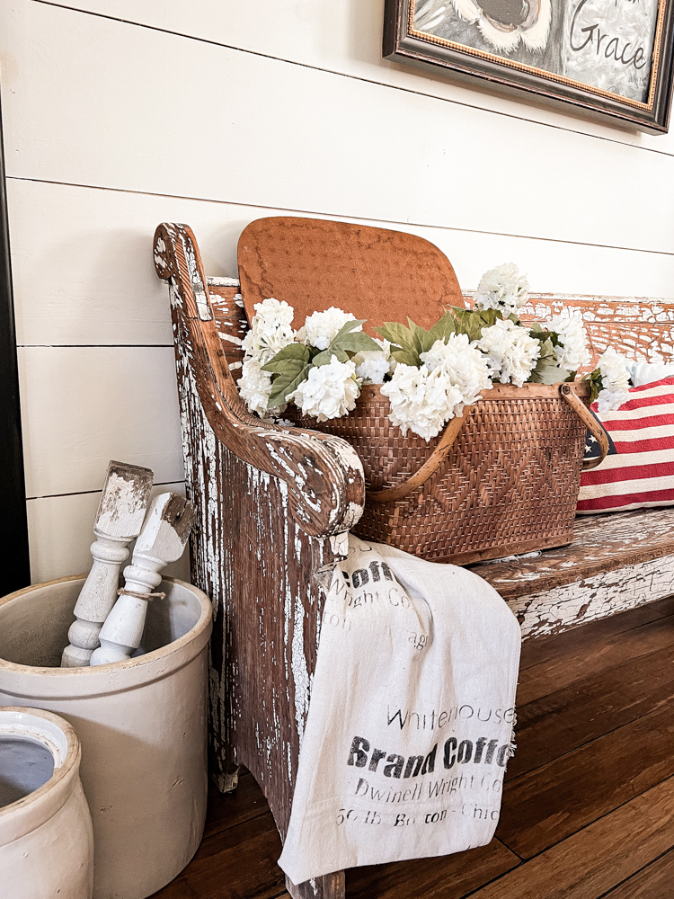 Picnic Basket on Church Pew with Flowers from The Ponds Farmhouse - Midwest Life and Style Blog