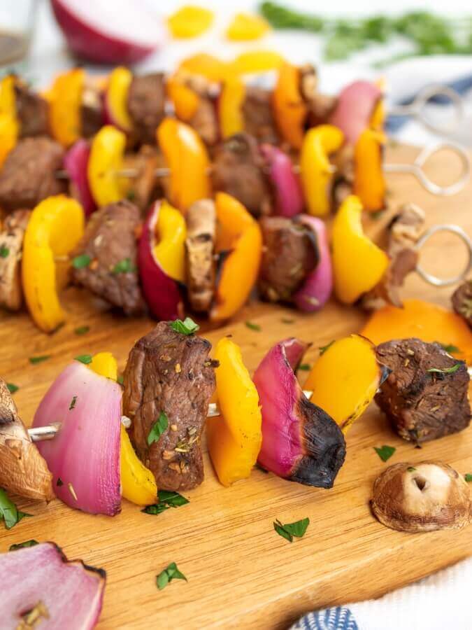 Beef skewer, mustard dressing and fried rosemary