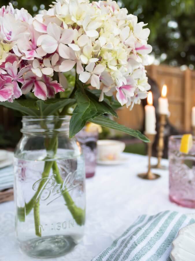 Hydrangea Bouquet in a Ball Jar on Oudoor Picnic Table - Midwest Life and Style Blog