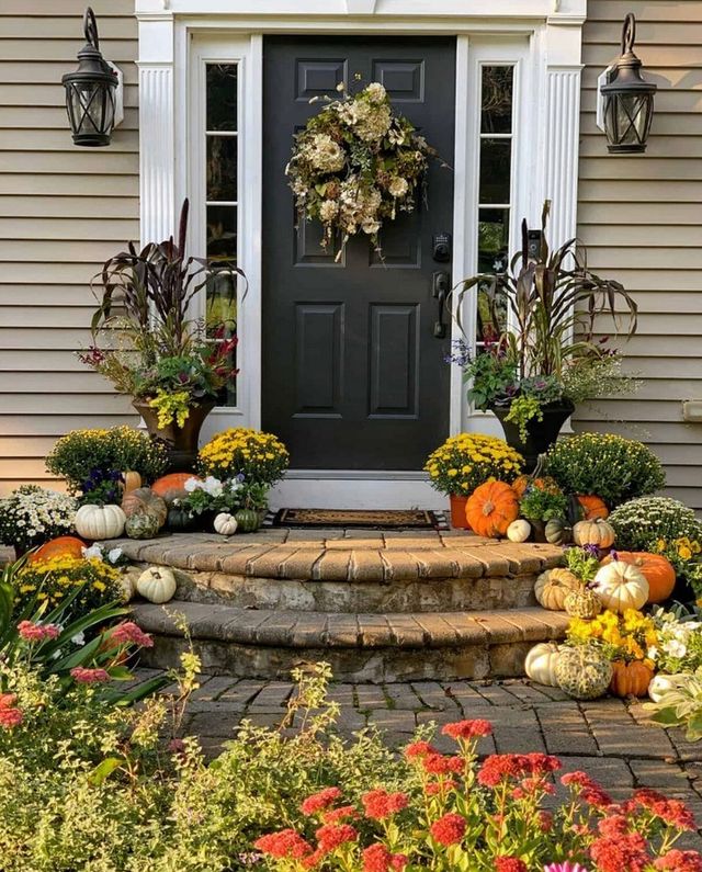 Fall Porch filled with Mums and Wreath on Front Door - Midwest Life and Style Blog