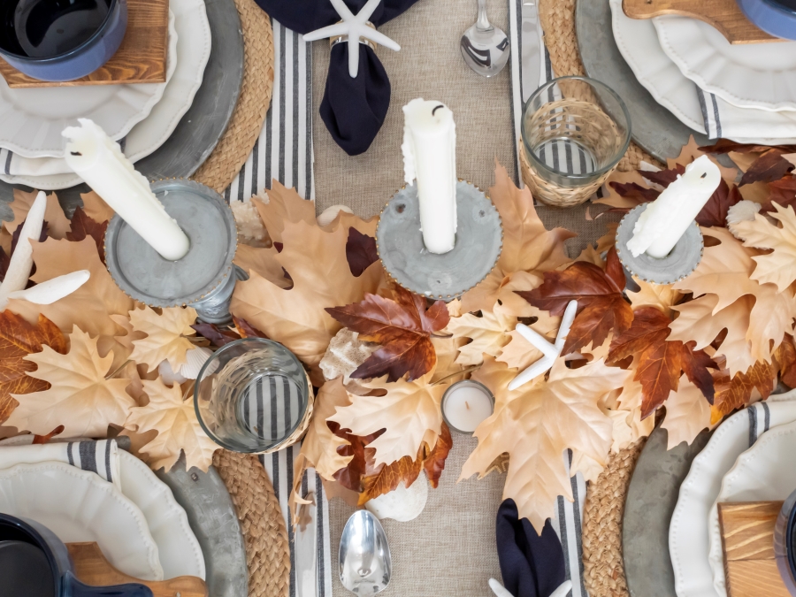 Overhead view of fall tablescape with coastal-inspired decor and accents 