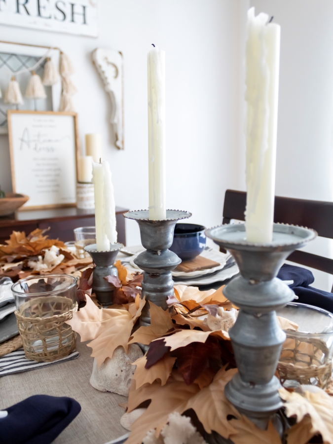 rustic galvanized candle holders styled on a coastal fall tablescape