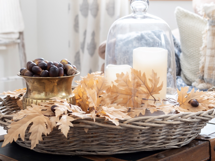 Glass Cloche in Wicker Bakset with Neuttral Fall leaves, candles and acorns - Midwest Life and Style Blog