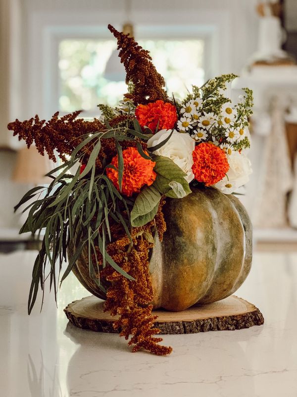 Pumpkin and Flower Centerpiece from Eleanor Rose Home - 15 Simple And Festive Ideas For Thanksgiving at Midwest Life and Style Blog