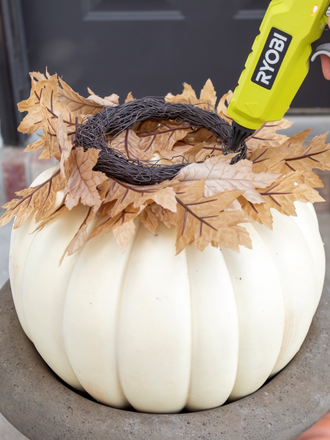 Hot Gluing on Fuax Fall Leaves - How To Make A Stacked Pumpkin Topiary 