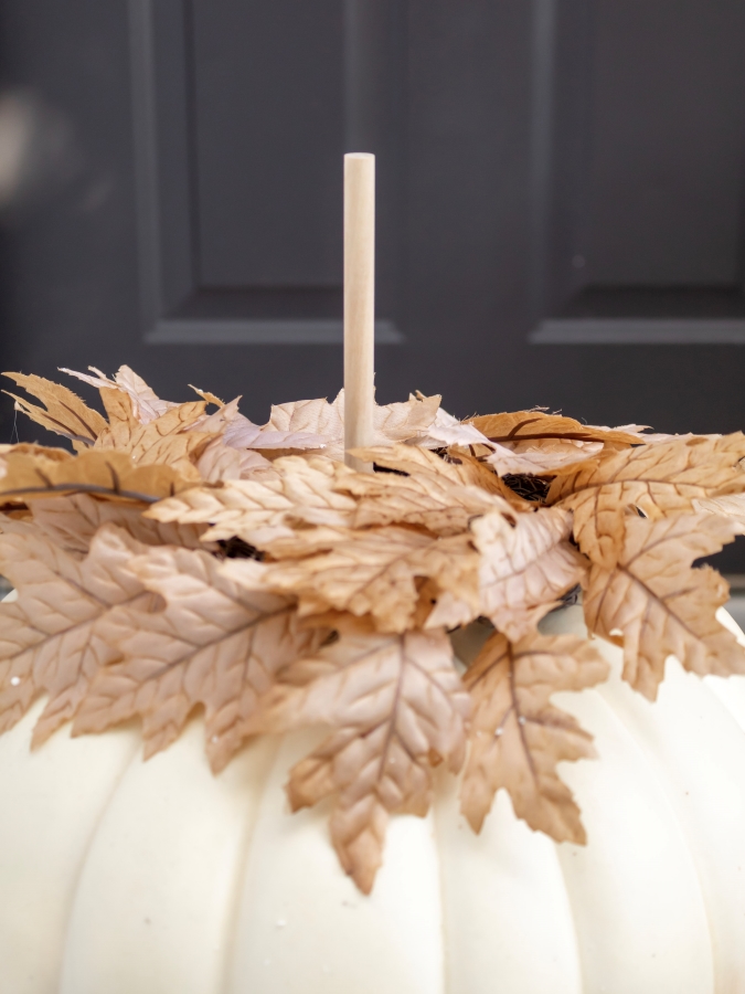 Faux Leaves and Dowel Sticking Out of Foam Pumpkin - How To Make A Stacked Pumpkin Topiary 