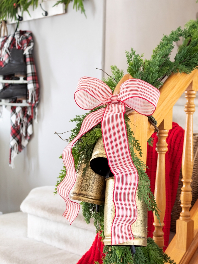 Red and Whtie Ticking Stripe Bow with Gold Bells and Garland on Stairs - Midwest Life and Style Blog