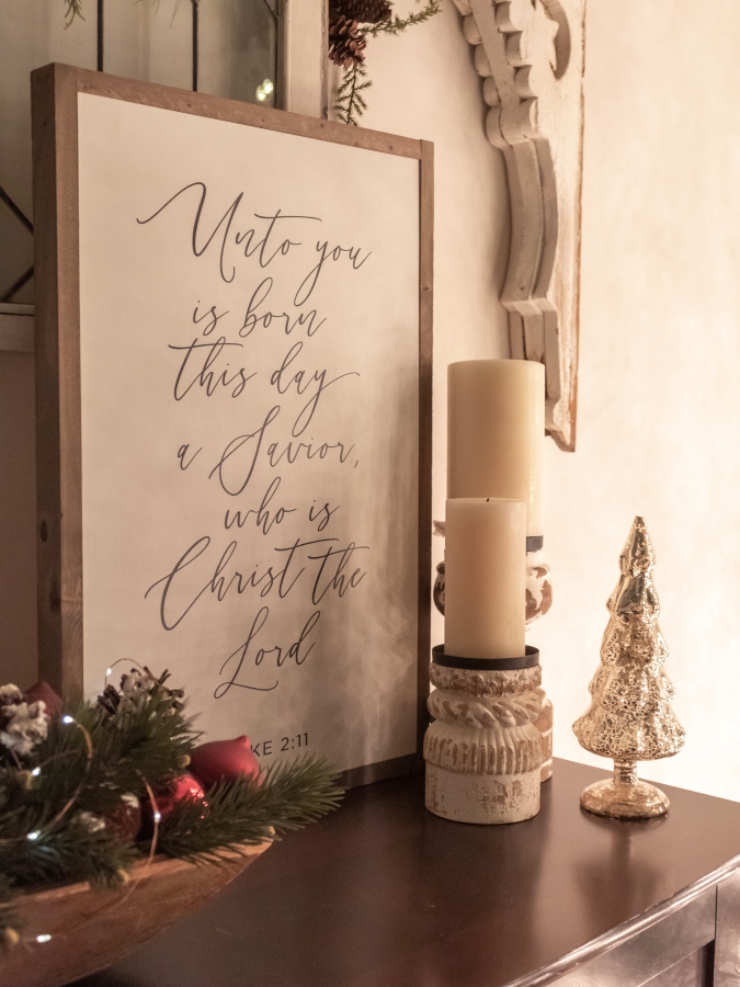 Christmas sign displayed on a console table with the bible verse Luke 2:11