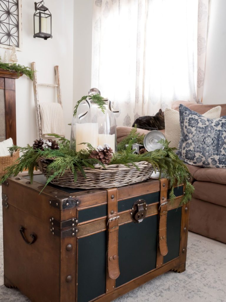 Cozy Winter Living Room with Vintage Vignette and Greenery in Basket - Midwest Life and Style Blog