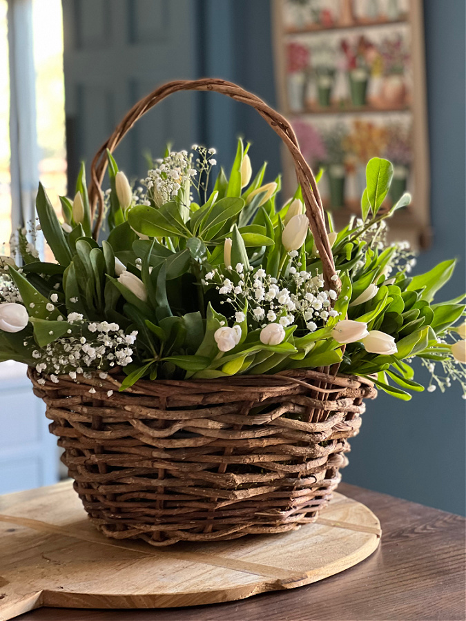 Spring Flower Arrangment in a Basket from The Tattered Pew - 10 of the Best Creative Spring DIY Crafts - Midwest Life and Style Blog