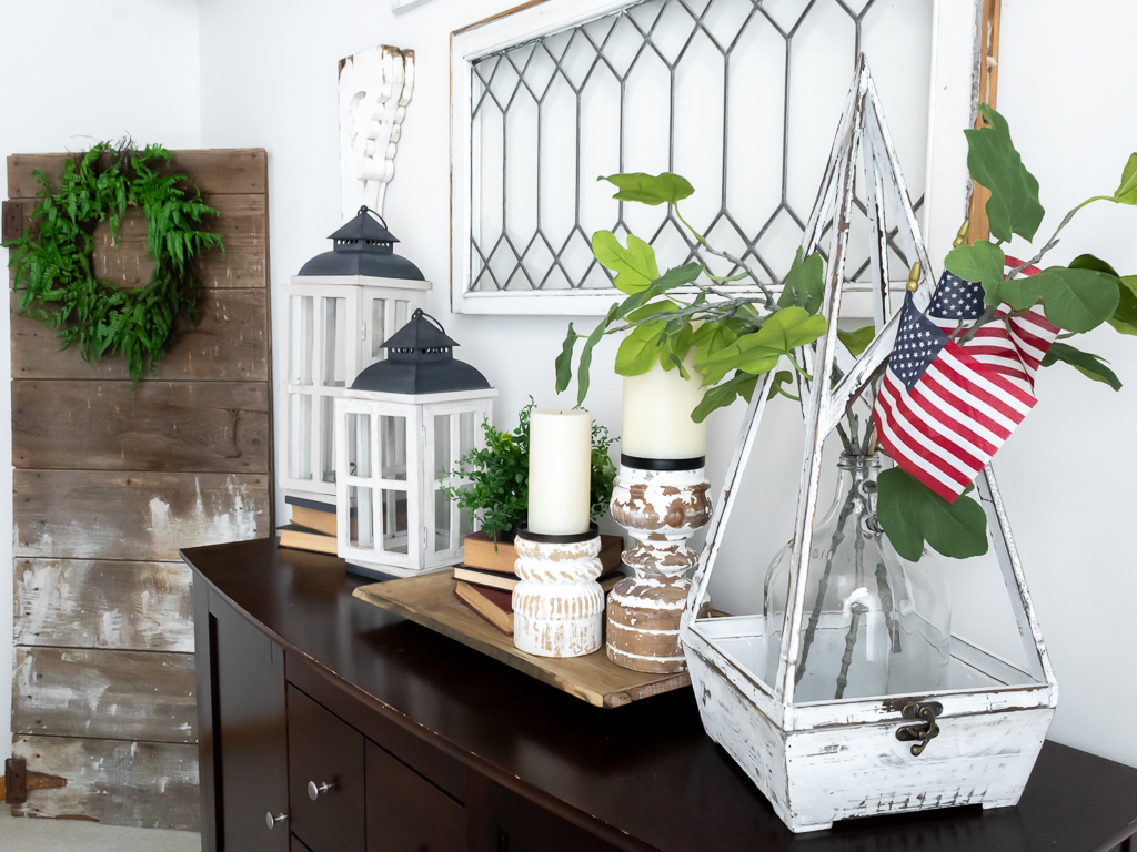 Patriotic Cottage-Style Vignette in Dining Room with Lanterns and American Flags, Leaded Window and Corbels - Red White And Blue Summer Home Tour - Midwest Life and Style Blog