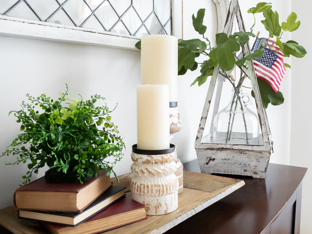 Vintage Red Books with Chunky White Candles and American Flags on Display in Dining Room - Red White And Blue Summer Home Tour - Midwest Life and Style Blog