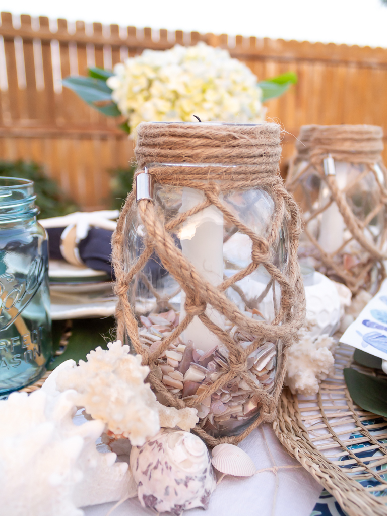 Beach Tablescape Centerpiece with Glass Candle Holders with Rope Handles and Crushed Seashell Filler - Midwest Life and Style Blog 