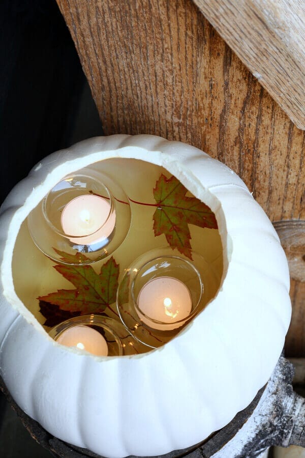 Faux pumpkin with floating votives from The Tattered Pew