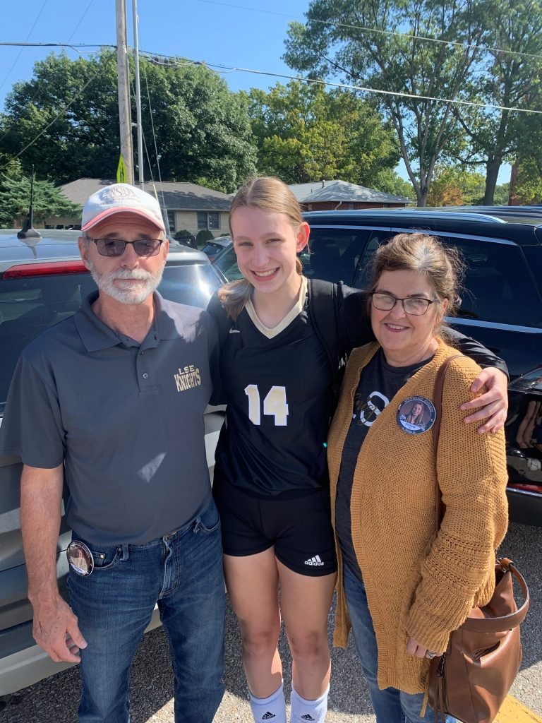 Peyton and my parents post=volleyball match