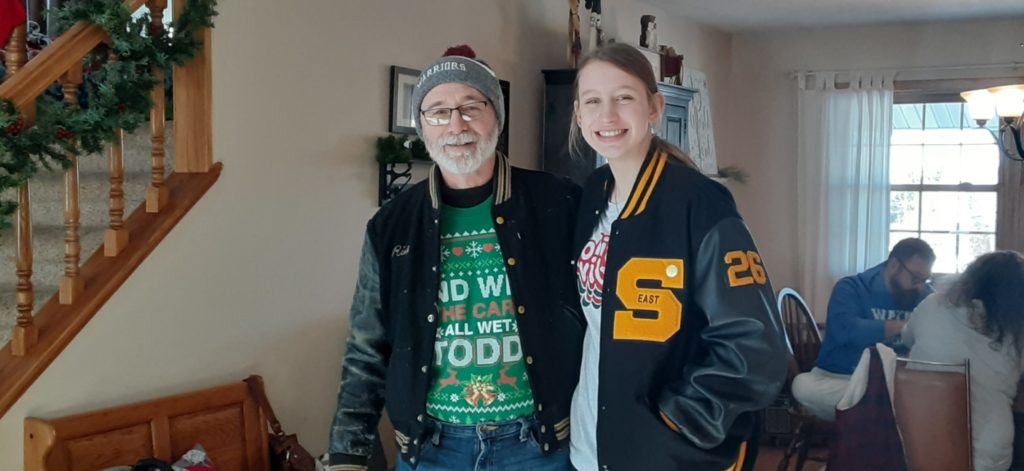 2 generations of athletes with letterman jackets