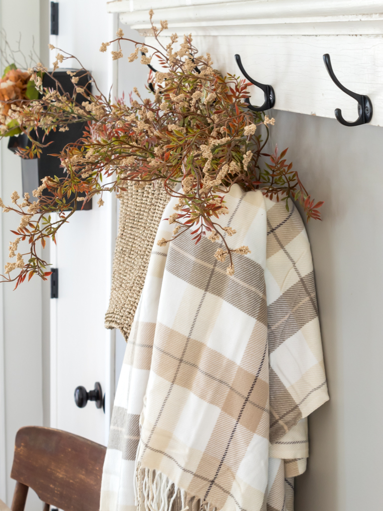 Hanging Straw Basket with Fall Florals and Plaid Blanket - Midwest Life and Style Blog