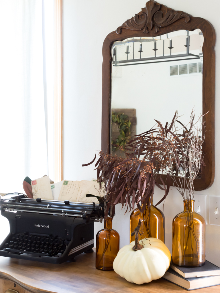 Fall Vignette with Vintage Typewriter and Amber Bottles - Midwest Life and Style Blog