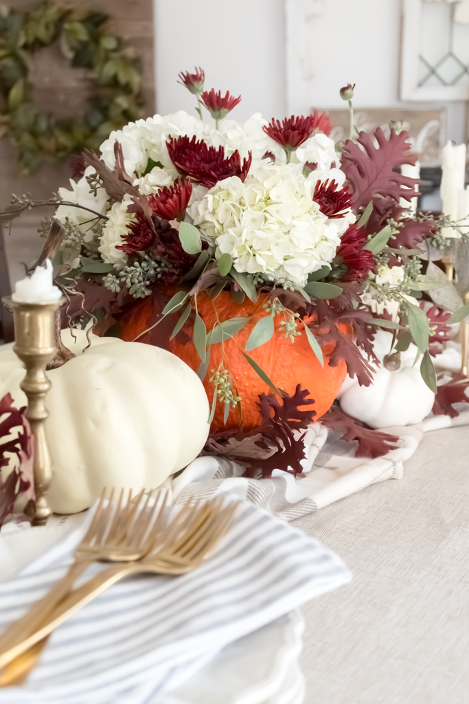 Pumpkin Centerpiece with Fall Flowers on Thanksgiving Table - Midwest Life and Style Blog