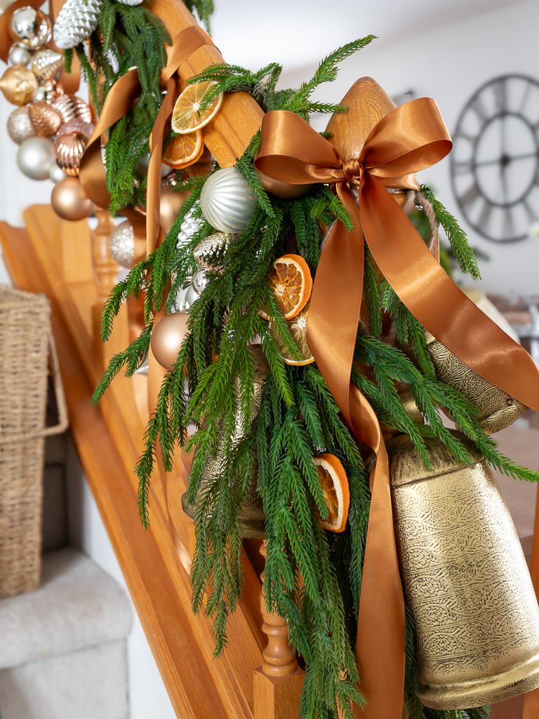 Dried oranges and ornament garland on staircase