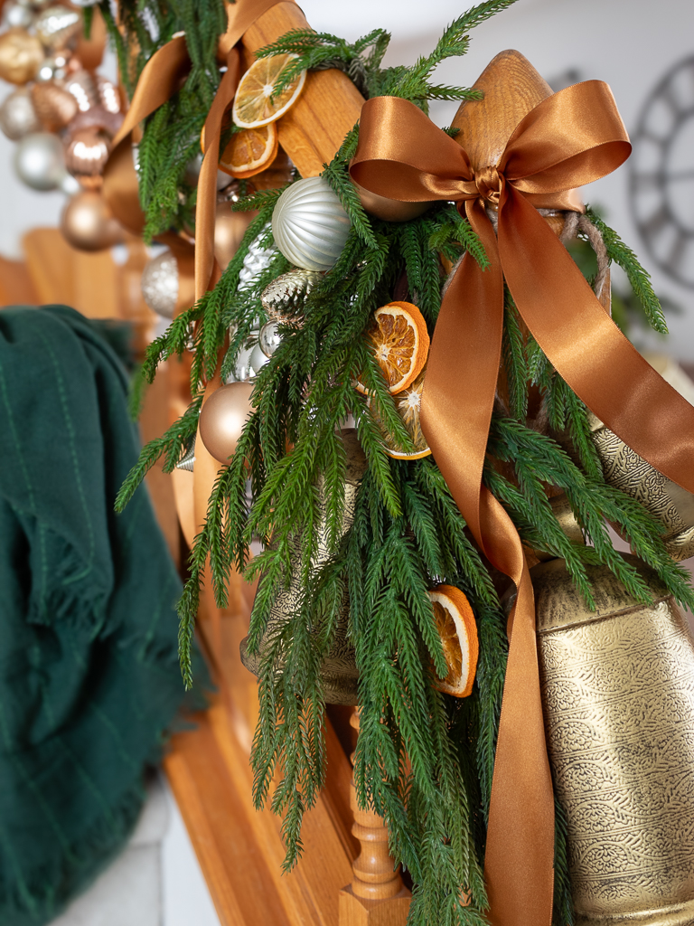 Dried oranges and ornament garland on staircase