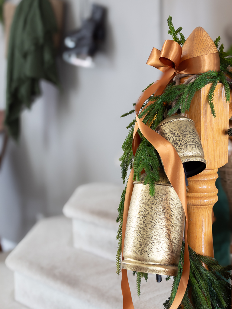 Gold Bells and  Ribbon with Garland on Christmas Stairs