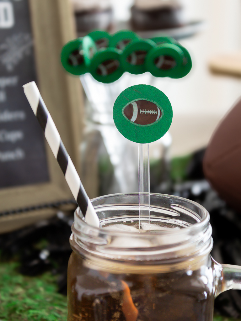 Green DIY drink stir stick with football stickers for party for the Big Game 